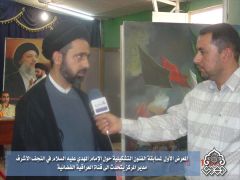 المعرض الاول لمسابقة الفنون التشكيلية / مدير المركز مع قناة العراقية