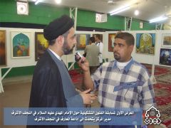 المعرض الاول لمسابقة الفنون التشكيلية / مدير المركز مع اذاعة المعارف